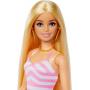Muñeca Barbie rubia con traje de baño y accesorios de playa