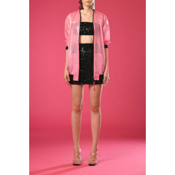 Black embroidered cropped top and skirt with pink jacket