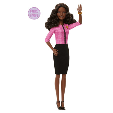Muñeca Barbie Future Leader con cabello castaño oscuro, 2 pulseras doradas y alfiler, incluye pegatina